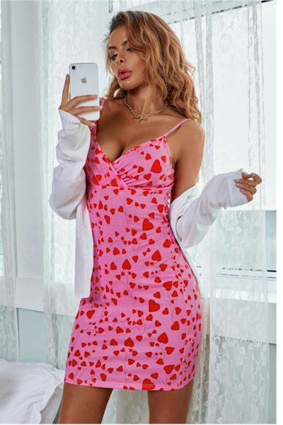 Strap Up for Style: Turn Heads in our Eye-Catching Hot Pink Hearts Mini Dress!