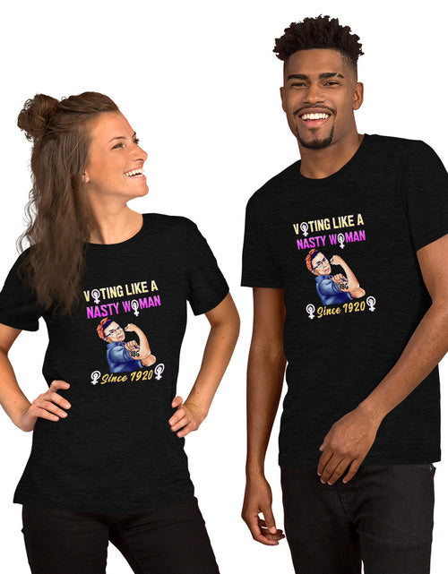 Load image into Gallery viewer, Couple Wearing RBG Voting Like A Nasty Woman... Short-Sleeve Unisex T-Shirt
